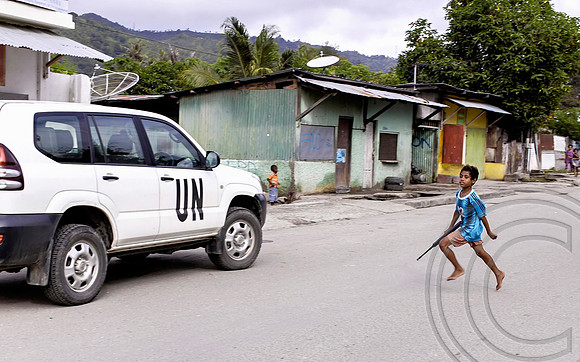 Boy runs towards UN vehicle - Timor Leste (Winner International Loupe Award Photojournalism)
