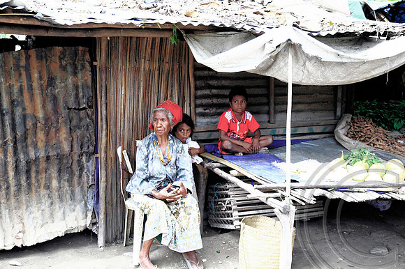 Grandma minding children at market stall in Timor Leste